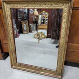 19th century gilt mirror with flowers and foliage decor
