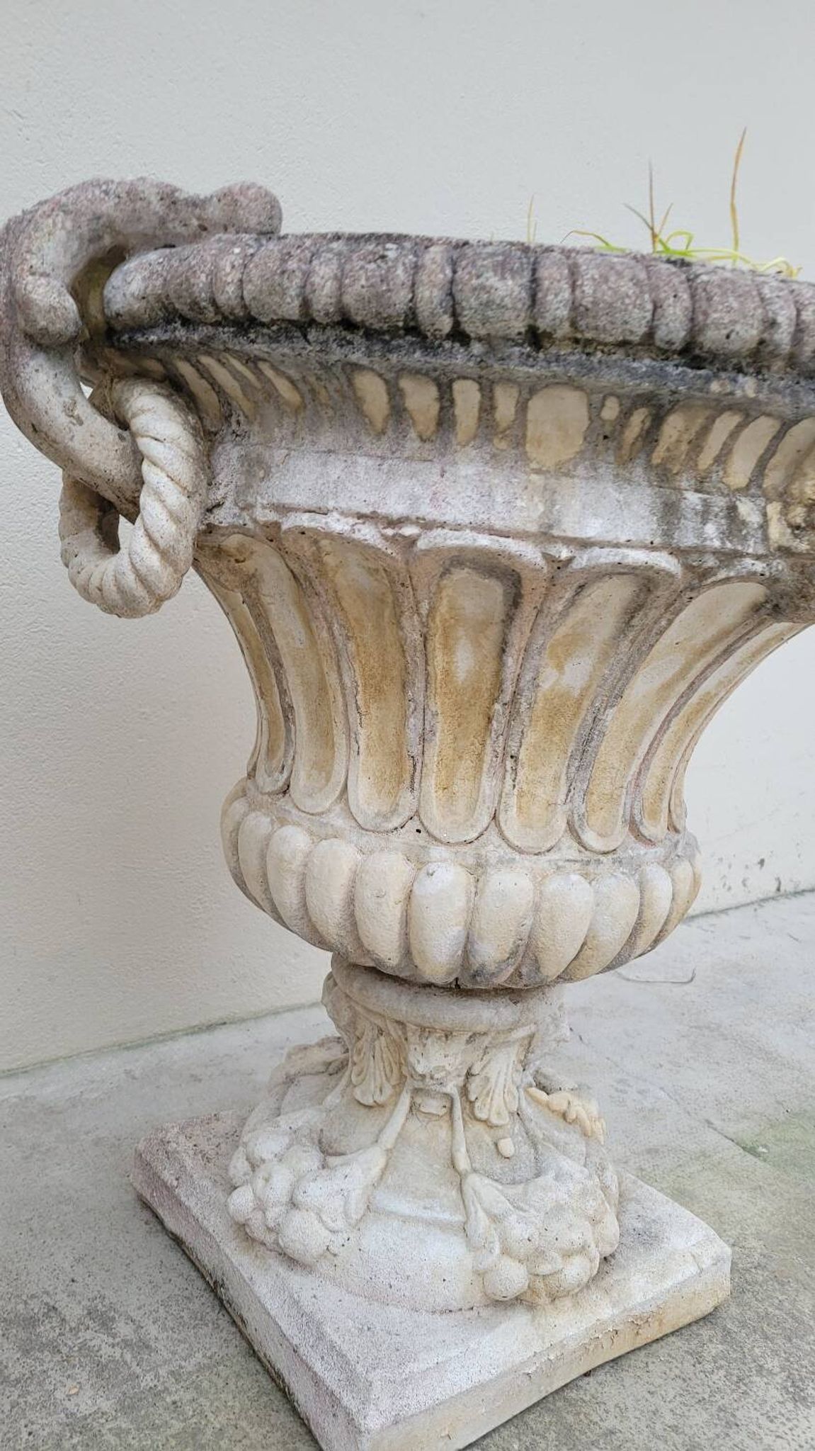 Pair of planter vases decorated with faces in reconstituted stone 1950s