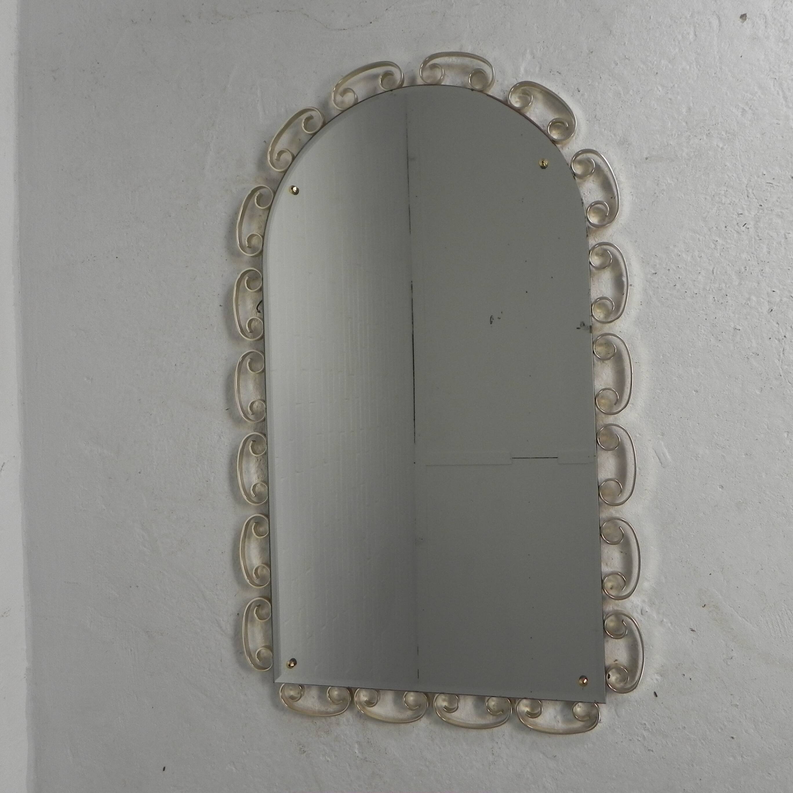 Vintage faceted mirror in an aluminium frame from the 1950s.