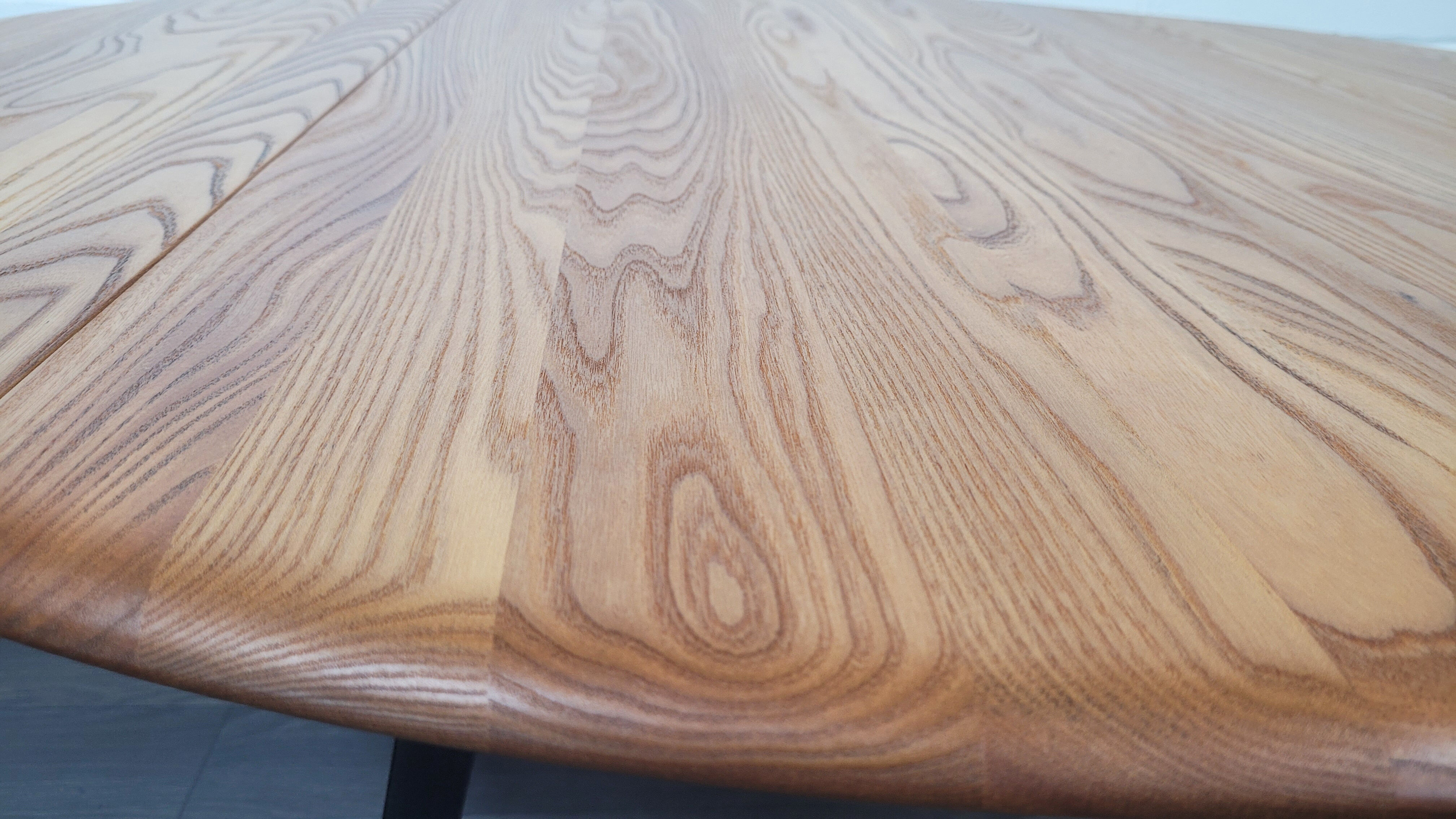 Ercol round drop leaf dining table - black leg, 1960