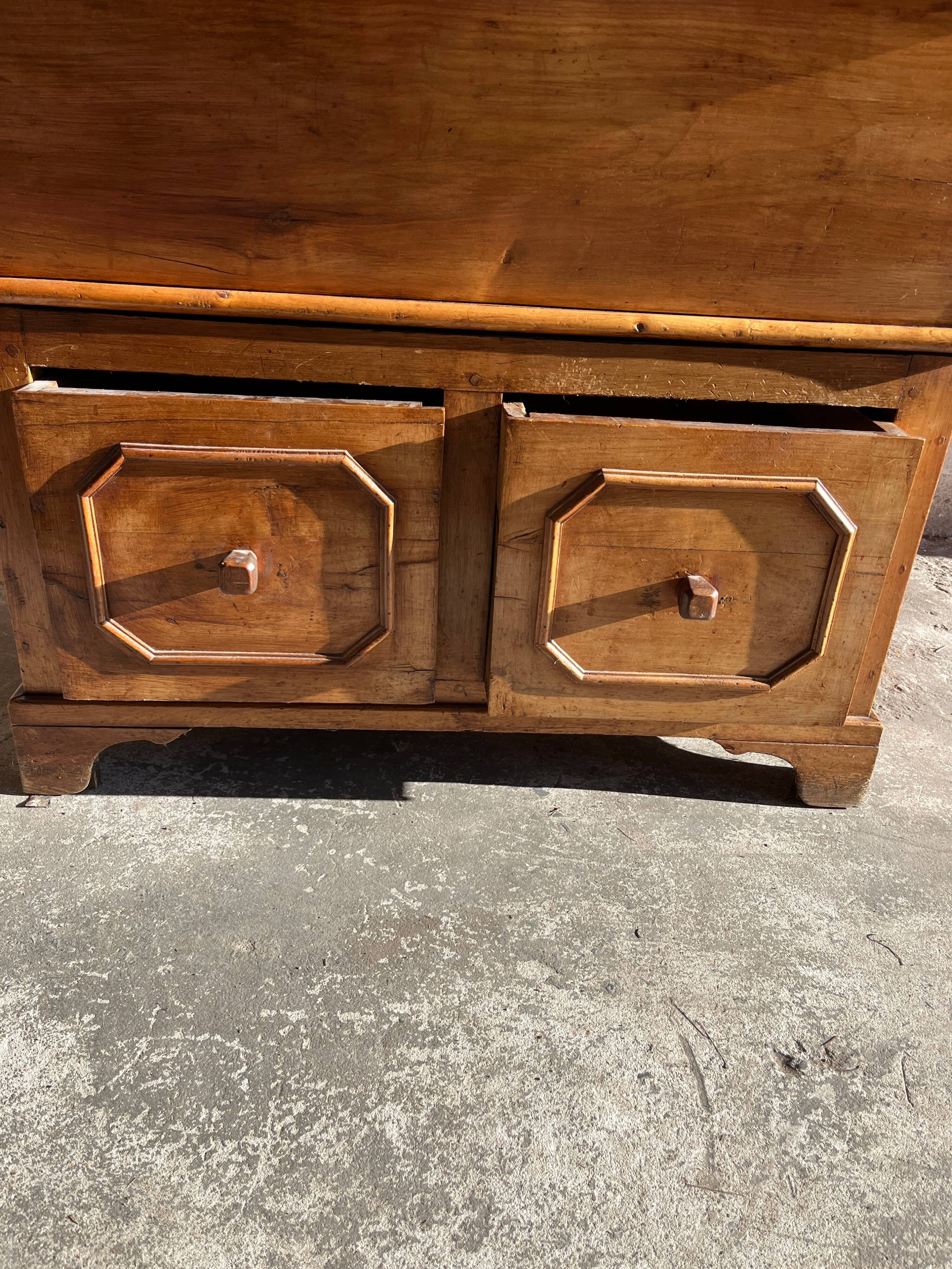 Old wooden baker's chest with storage drawers