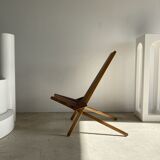 Foldable designer armchair in wooden slats