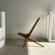 Foldable designer armchair in wooden slats