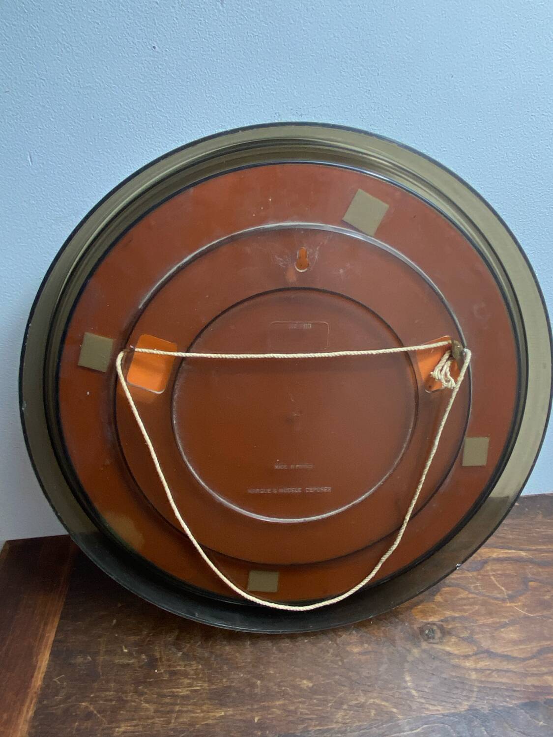 Circular mirror, smoked plastic, 1960s/70s.