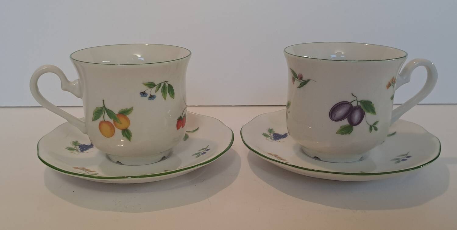 Two cups and saucers in fine porcelain, orchard model.