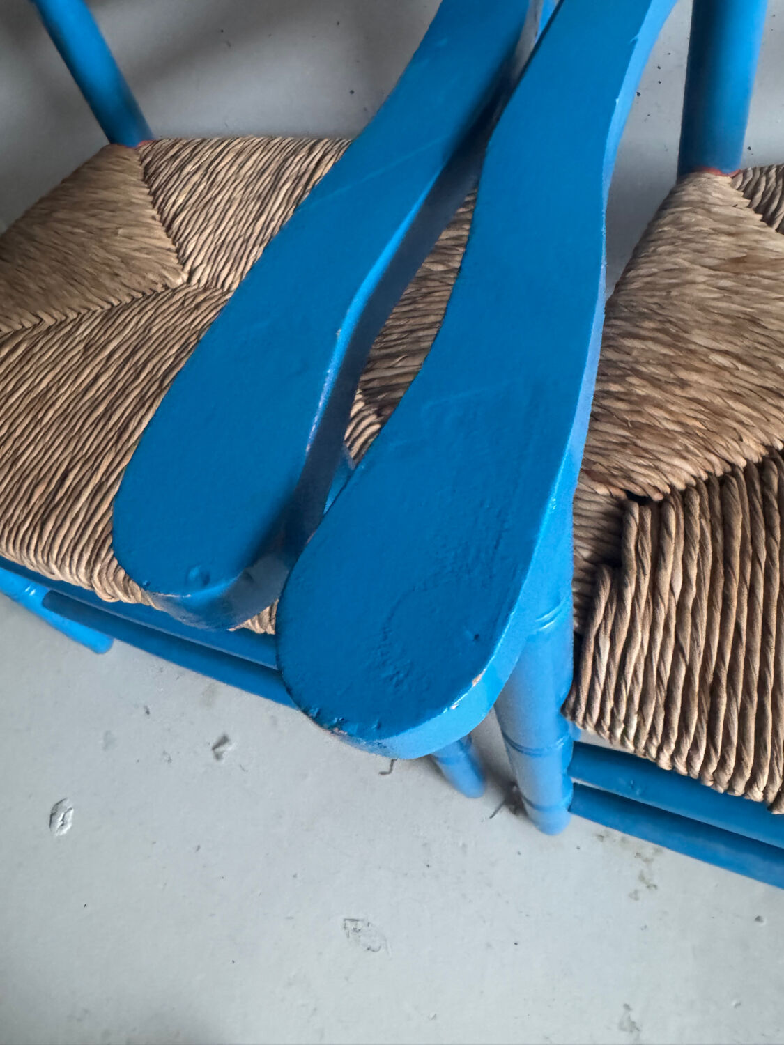 Pair of Provençal armchairs in painted wood and straw, around 1960.