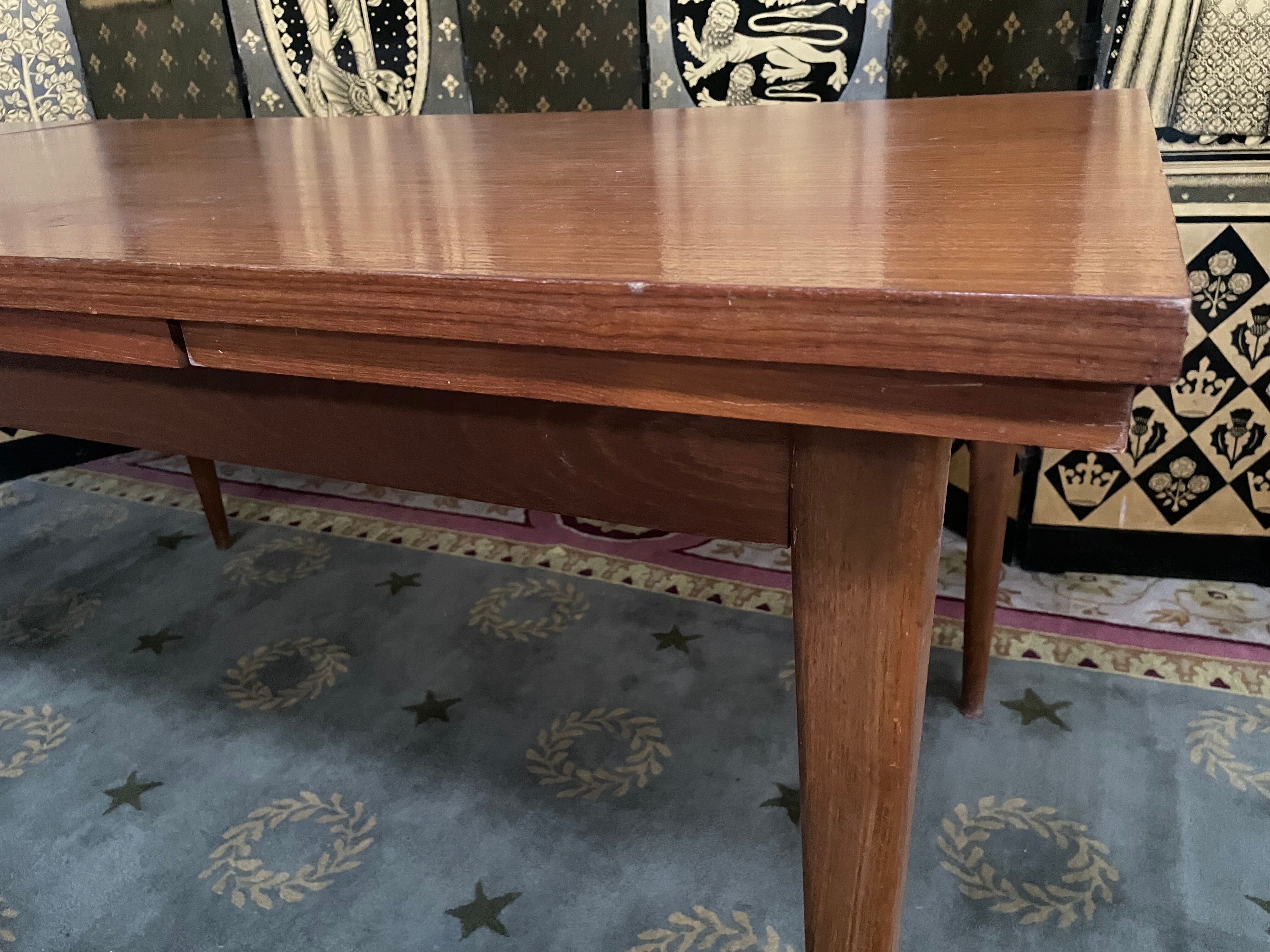 Scandinavian dining table with built-in extensions