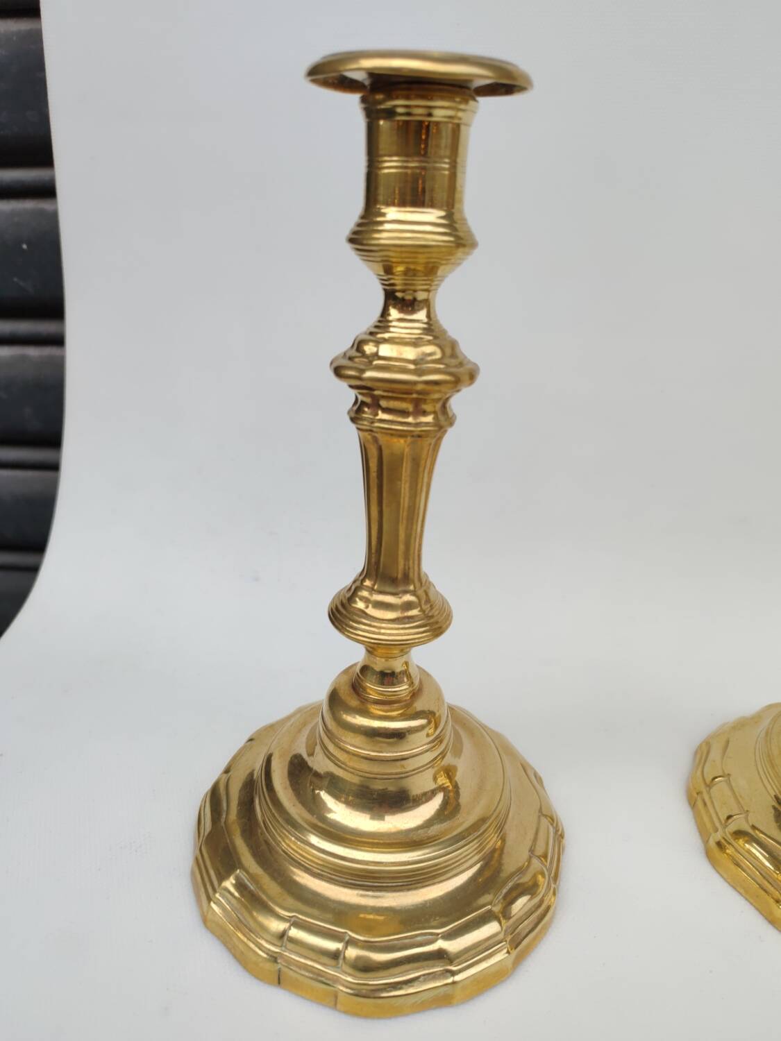 Pair of solid brass candlesticks, early 18th century.