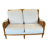 Sofa and armchair in cane and wood by Jean Roche