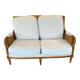 Sofa and armchair in cane and wood by Jean Roche