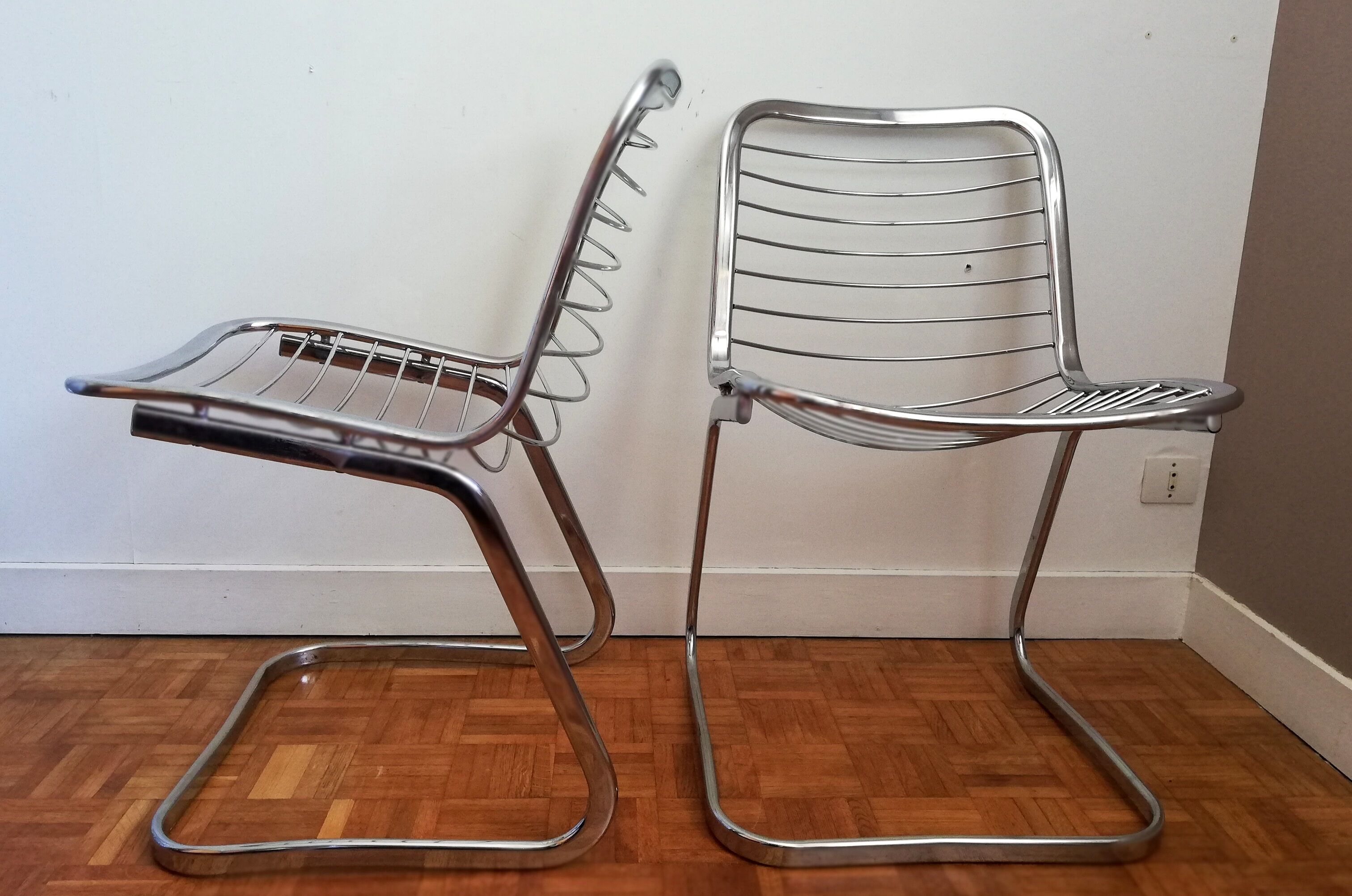 2 chrome wired chairs