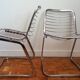 2 chrome wired chairs