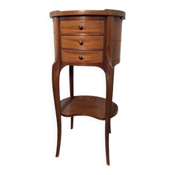 Oval bedside table in Louis XV style made of mahogany.