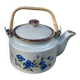 Chinese ceramic and rattan teapot