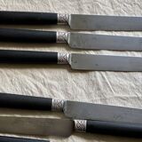 Set of 12 19th century table knives with ebony and chiseled silver handles