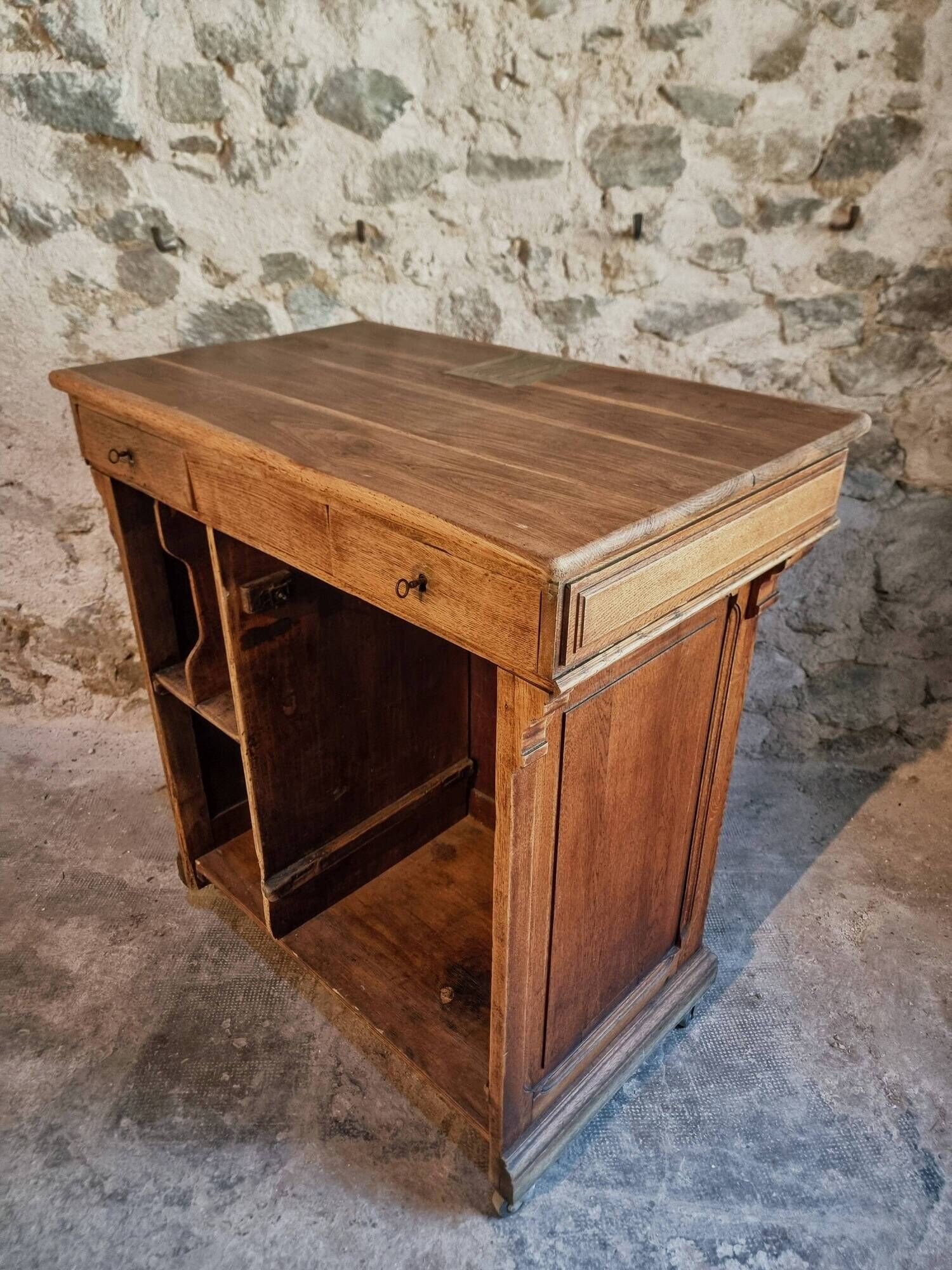 Antique French oak shop counter, kitchen island on wheels, circa 1880–1900.