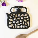Old enameled cast iron trivet
