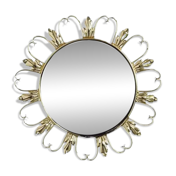 Miroir rond sur cadre laiton à volutes