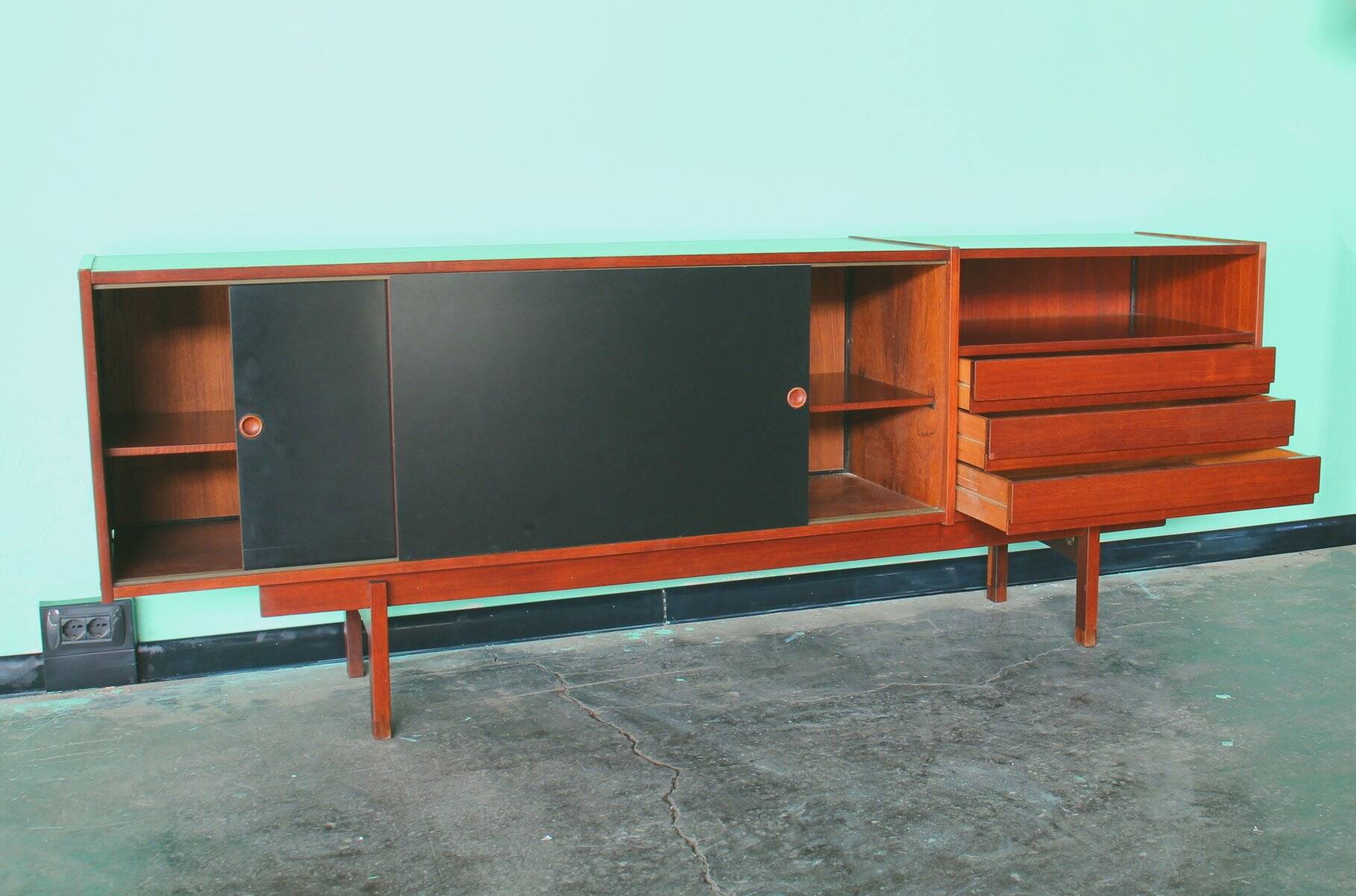 Enfilade or Mid-Century sideboard with sliding doors in black laminate by Saporiti Italia, Italy.