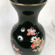 Black opal vase decorated with flowers