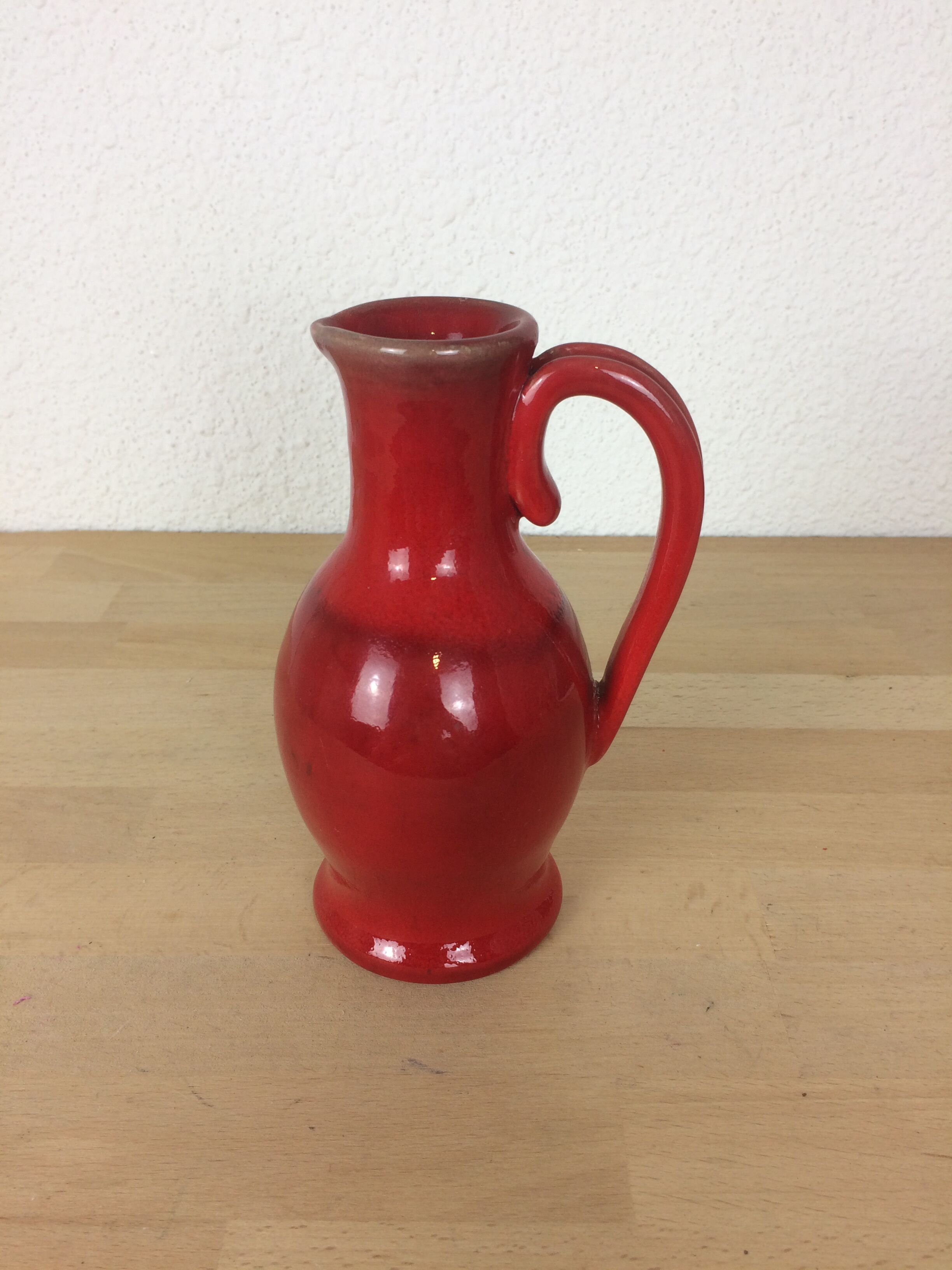 Red ceramic pitcher