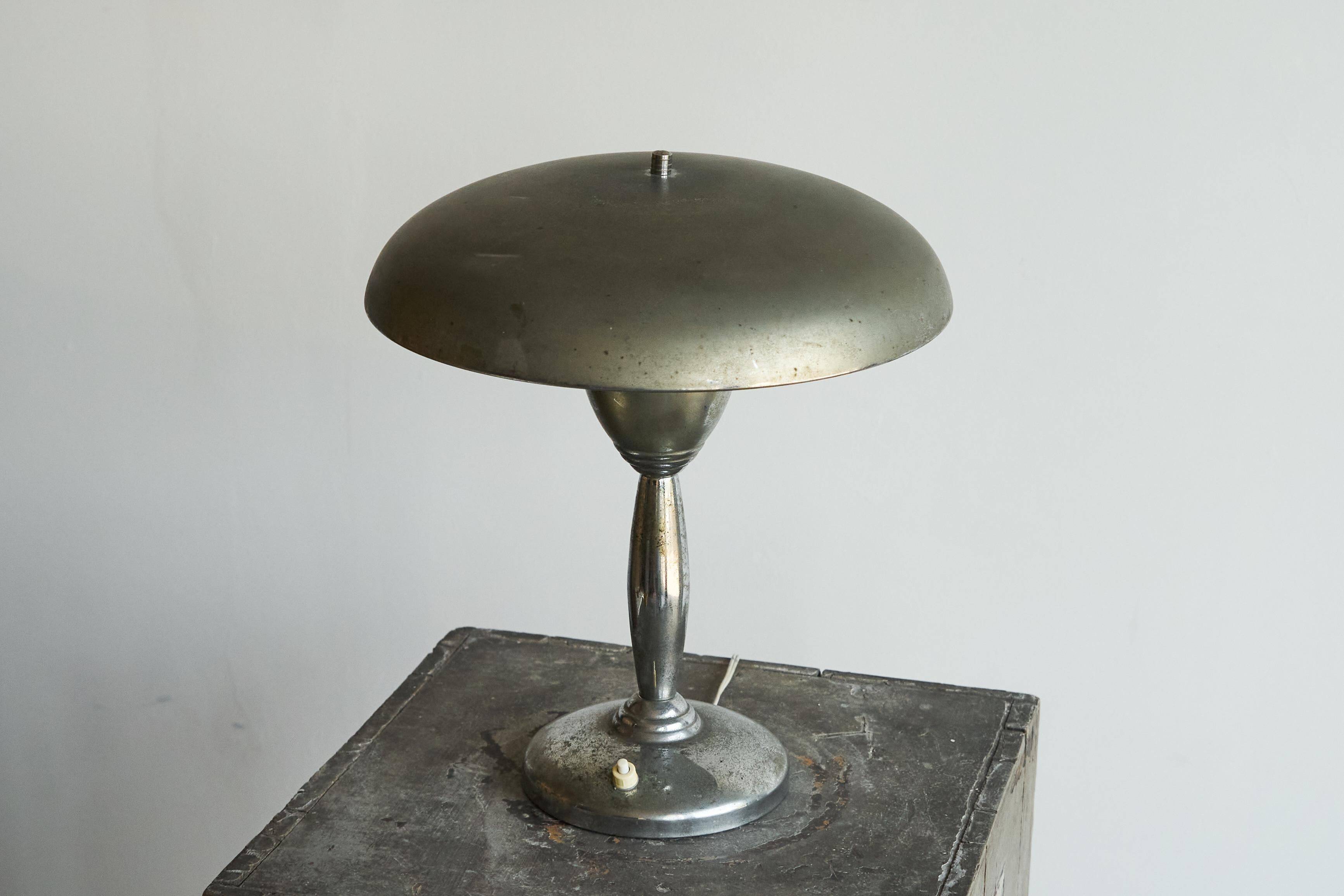Patinated brass and chrome table lamp from the 1950s.