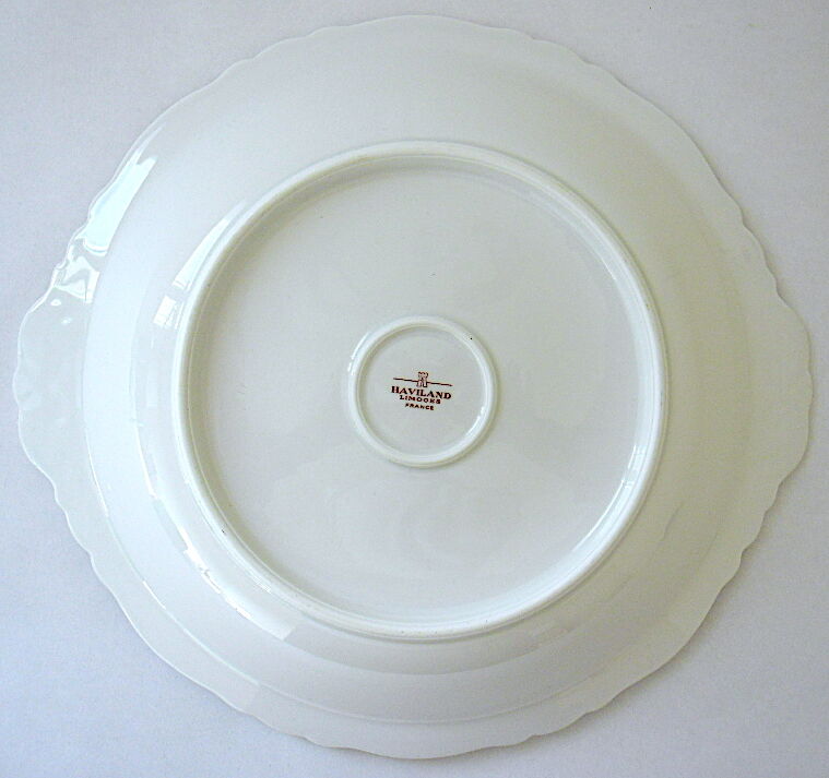 Hollow dish in white porcelain, golden lip.