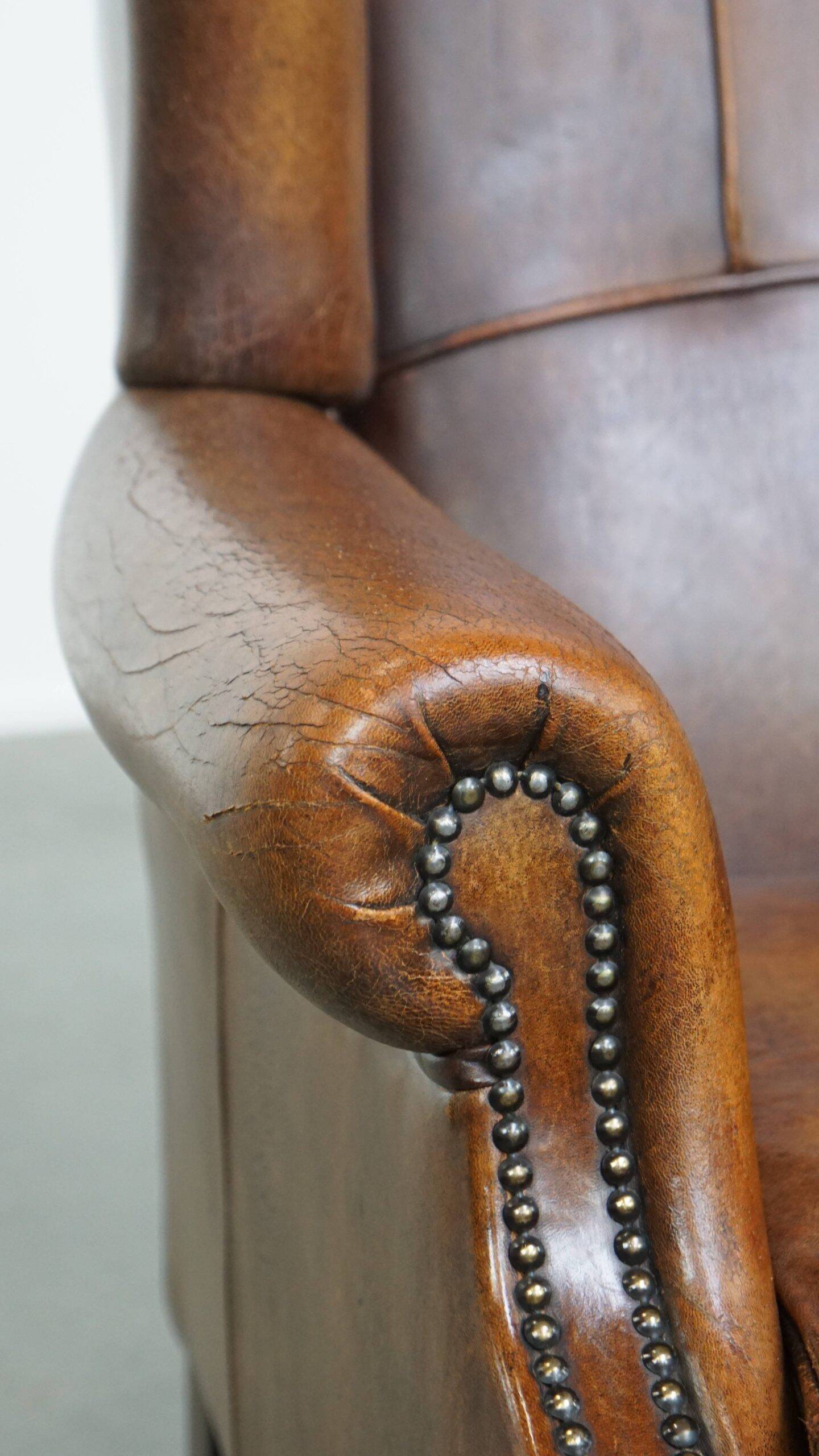 Sheepskin wingback chair in good condition