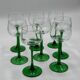 Set of 8 green stemmed wine glasses made in France.