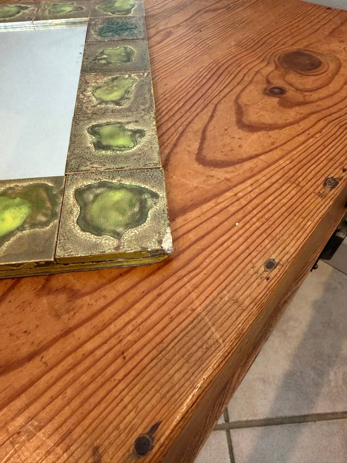 Vintage 1960s green and brown glazed ceramic mirror.