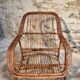 Vintage rattan lounge set, French wicker armchairs and round table, circa 1930–1950.