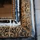 Antique mirror with carved wooden frame