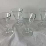 4 glasses of moulded pressed glass wine on foot