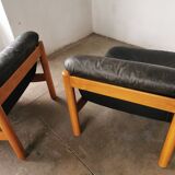 Pair of designer leather armchairs 80s