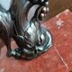 Zinc art bookends in the shape of birds on red marble - warblers