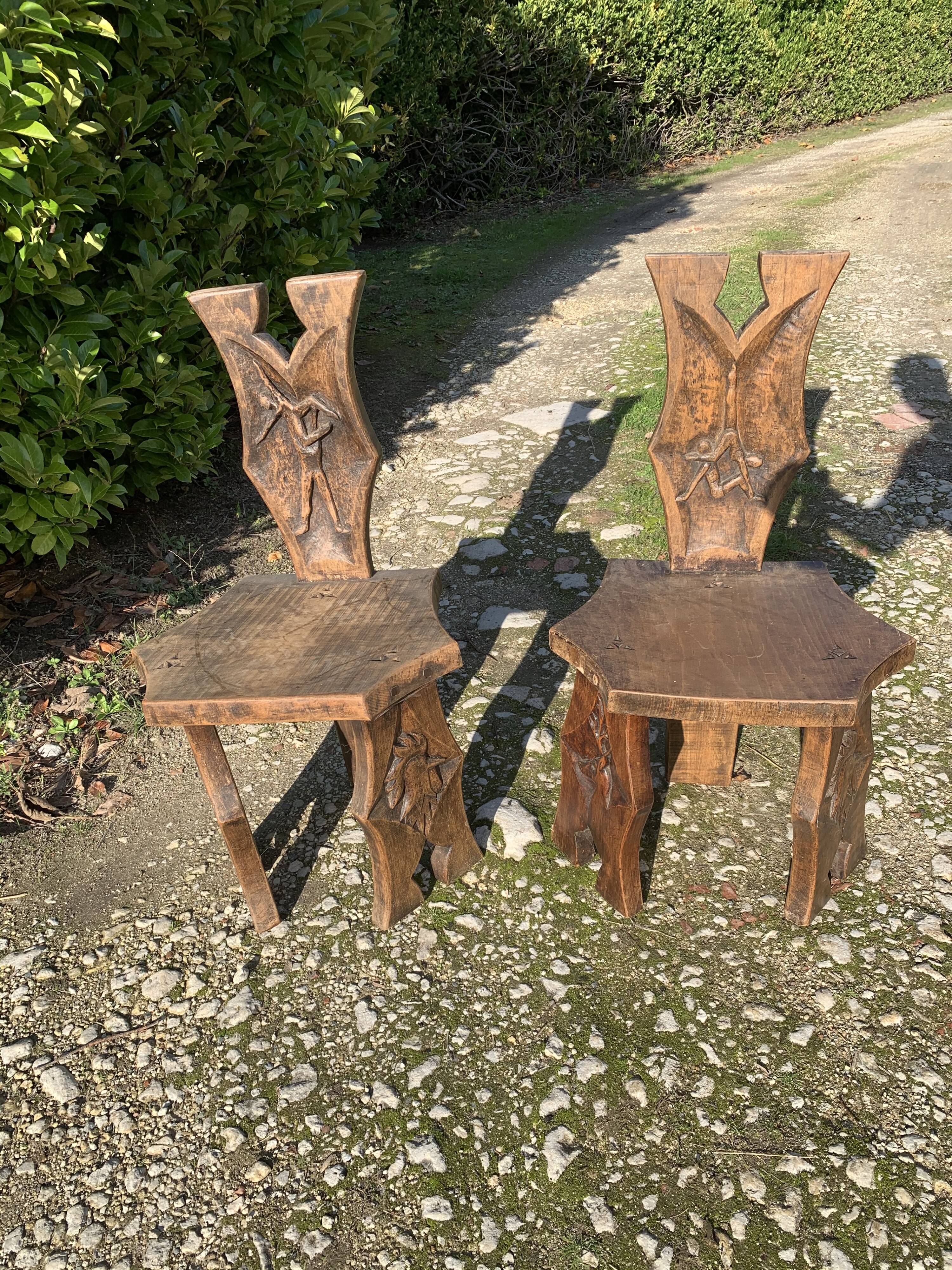 2 solid wood Johnny Ludecher folk art chairs