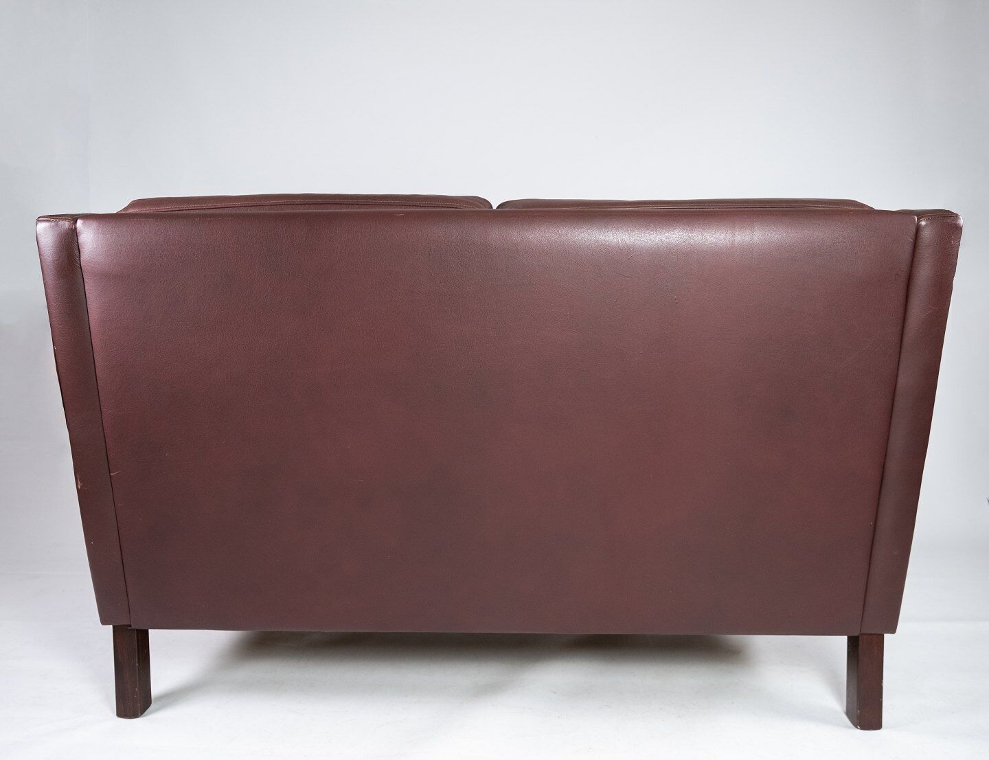 Two seater sofa, with red brown leather by Stouby Furniture