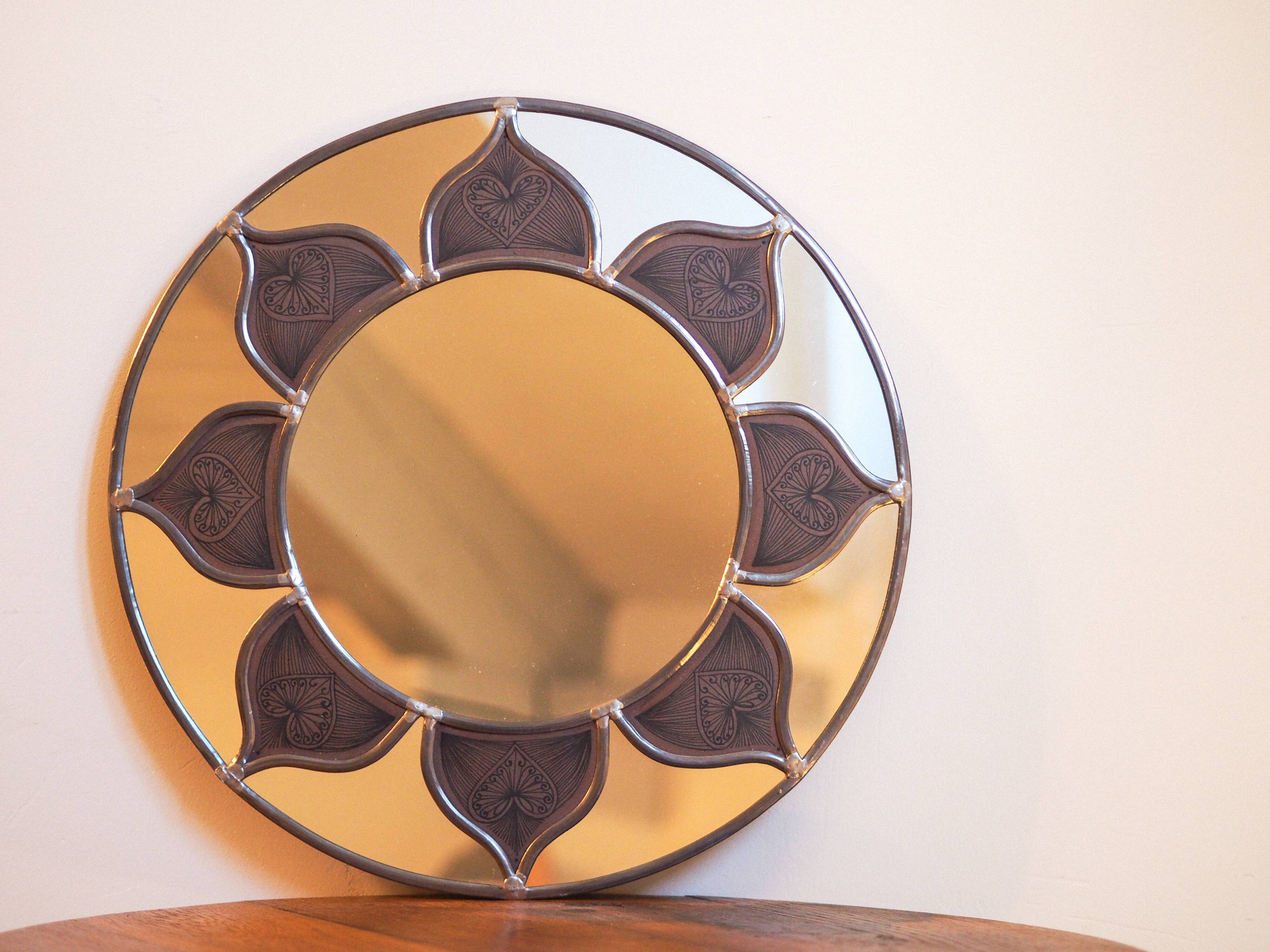 Mirror sun stained glass and ceramic inclusions