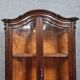 Curved library with two walnut doors, in Louis XV style.