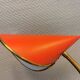 Danish red lacquered wall light with brass details. Estimated 1980s