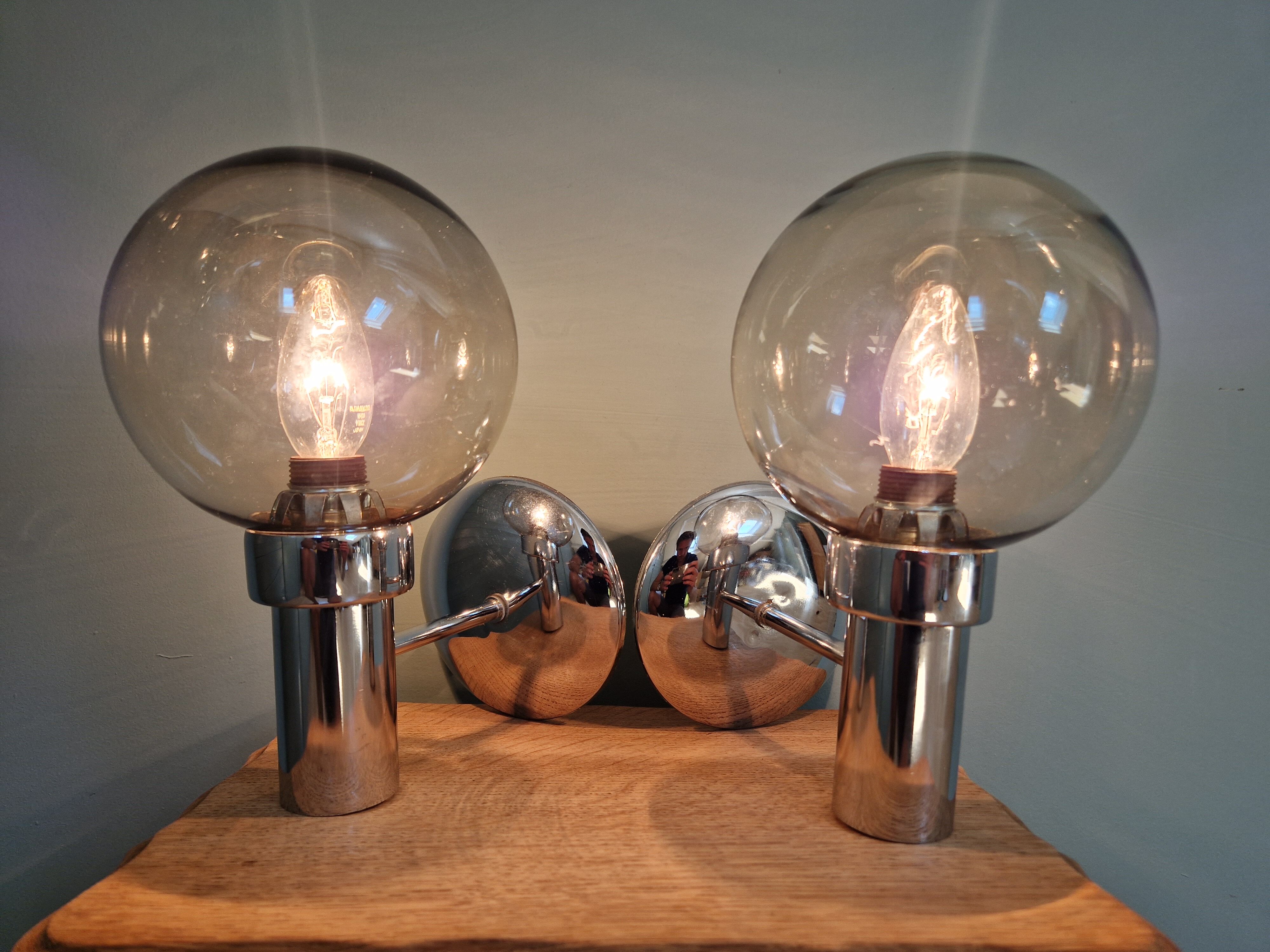 Pair of vintage wall lights in chromed metal and smoked glass, 70s