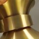 Large hanging lamp, made of brass-coloured aluminium with red and white contrast lacquer inside.
