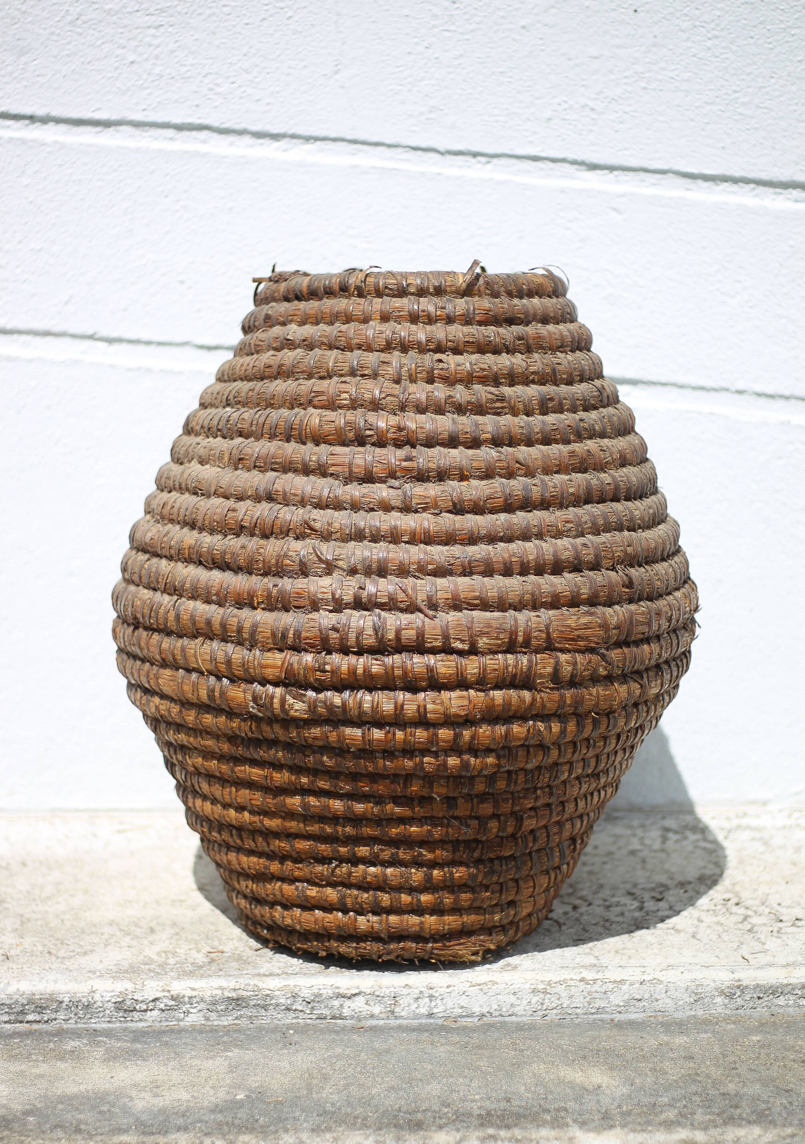 Old basket, burgundy straw and bramble, woven basket, interior decoration