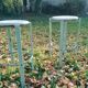 Pair of green factory-style bar stools.
