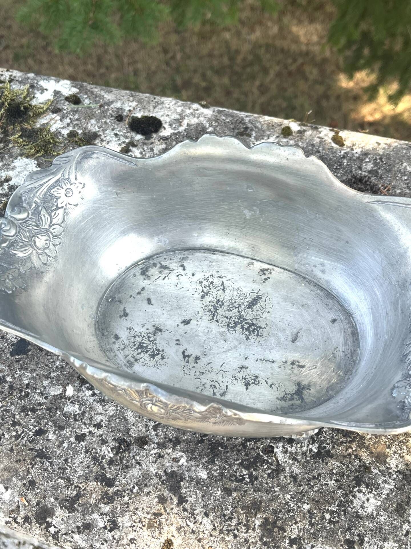 Footed pewter champagne cooler on claw feet with floral relief