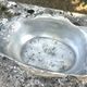 Footed pewter champagne cooler on claw feet with floral relief