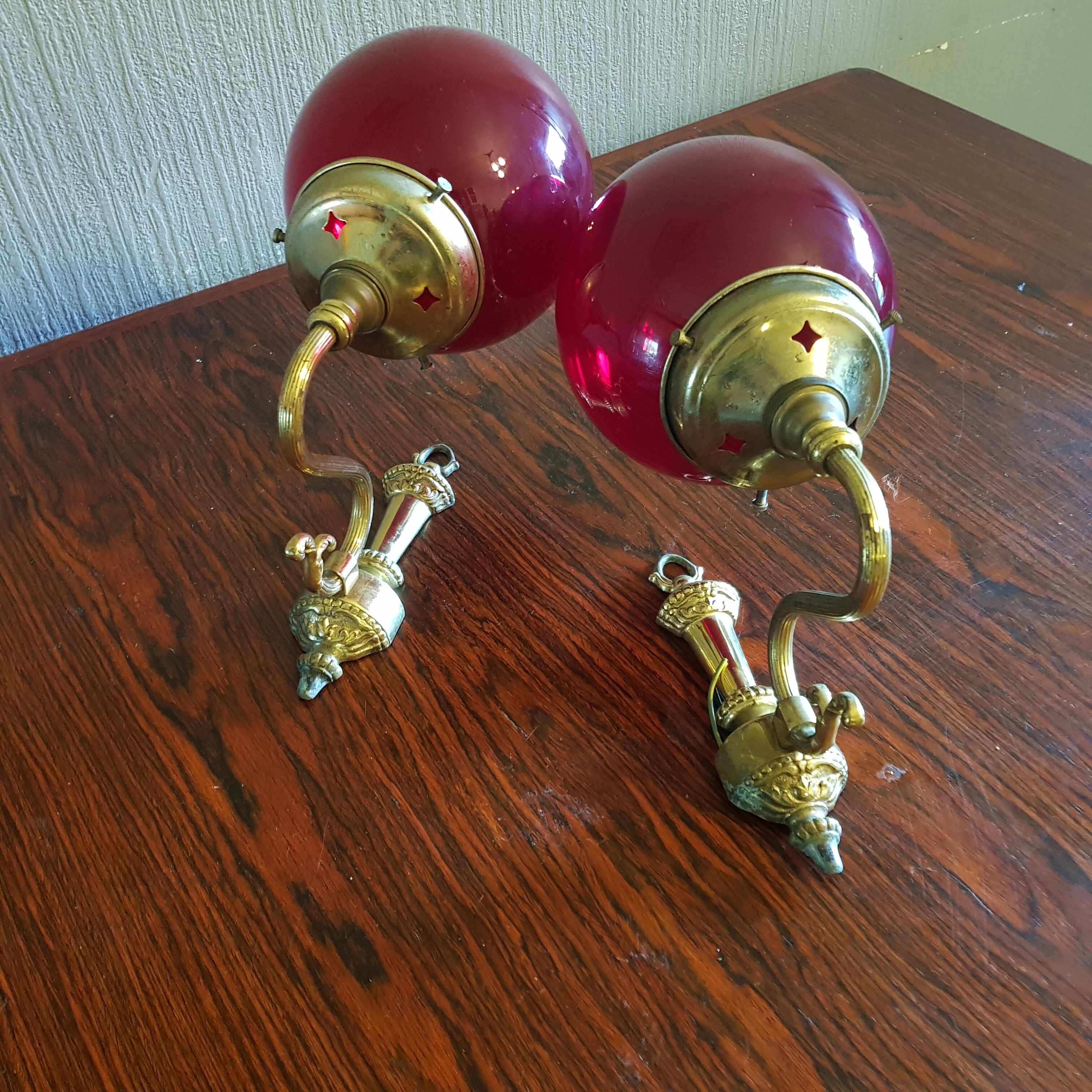 Pair of vintage brass wall light and cherry red globe