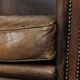 Characterful set of two sheepskin design armchairs with beautiful patina