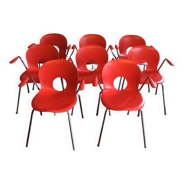 Set of 8 vintage red chairs by designer Raul Barbieri.