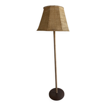 Teak base floor lamp with raffia and a large paper cord shade.